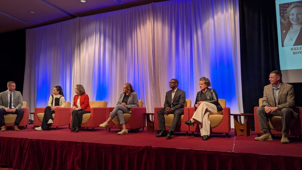 Democratic and Republican candidates for governor are working to build their name recognition and campaign throughout the state and had their first opportunity to appear on the same platform at a forum Thursday. Shown are, from left, Matt Smith of WISN-12, Francesca Hong, Sara Rodriguez, Kelda Roys, David Crowley and Missy Hughes, all Democrats, and Josh Schoemann, a Republican. (Photo by Baylor Spears/Wisconsin Examiner)