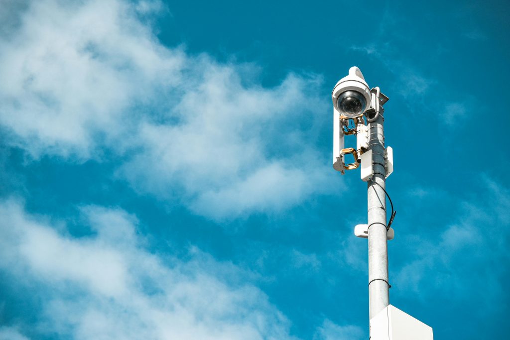 Photo by Ilman Muhammad: https://www.pexels.com/photo/white-cctv-camera-under-the-blue-sky-6570858/