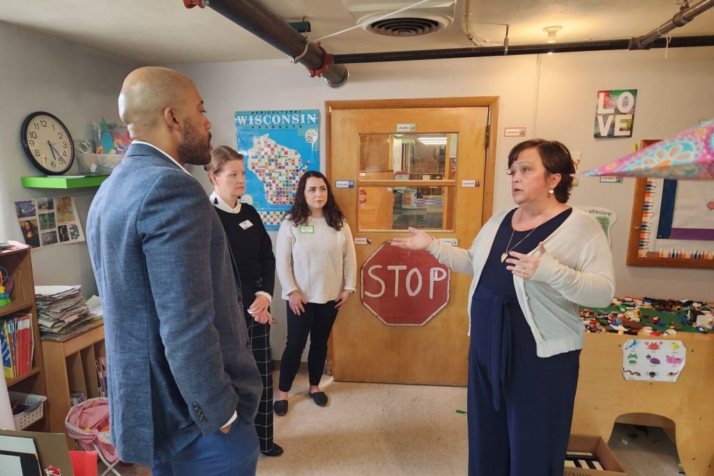 Child care provider Heather Murray, right, gives Mandela Barnes, left, who is seeking the Democratic nomination for Wisconsin governor, a tour of her facility, Art House Preschool in Waunakee. Joining them were, second from left, Paula Drew and Kayla Gardner, both from the Wisconsin Early Childhood Association. (Photo by Erik Gunn/Wisconsin Examiner)