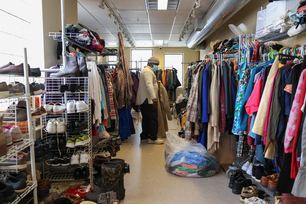 Volunteer Mike Sinclair organizes donations inside Repairers of the Breach, 1335 W. Vliet St., on Wednesday, Dec. 3. (Photo by Jonathan Aguilar / Milwaukee Neighborhood News Service / CatchLight Local)