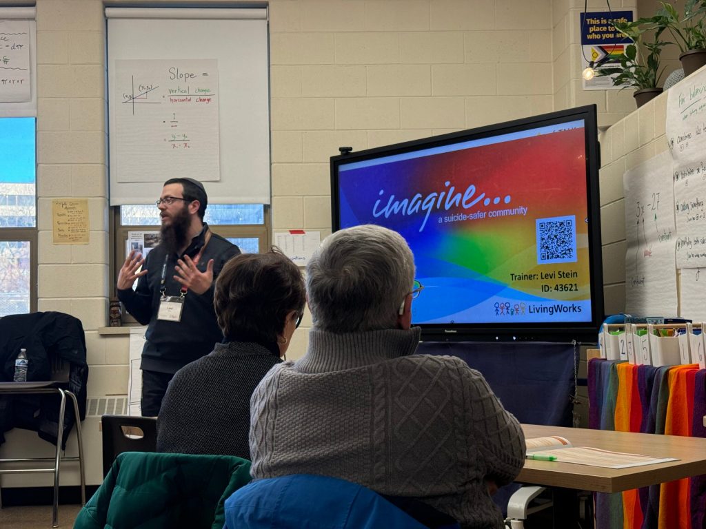 Levi Stein (left) is seen here during a SafeTALK training in Milwaukee on Thursday, Feb. 6., 2025. Evan Casey/WPR