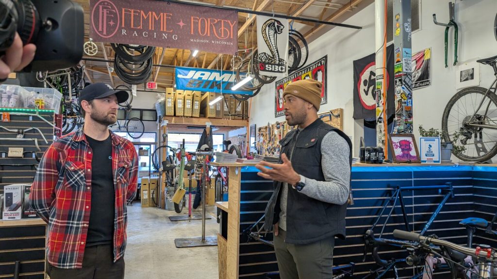 Democratic gubernatorial hopeful Mandela Barnes spoke with bike shop owner Mitch Pilon about rising costs under President Donald Trump and the effects of tariffs. (Photo by Baylor Spears/Wisconsin Examiner)