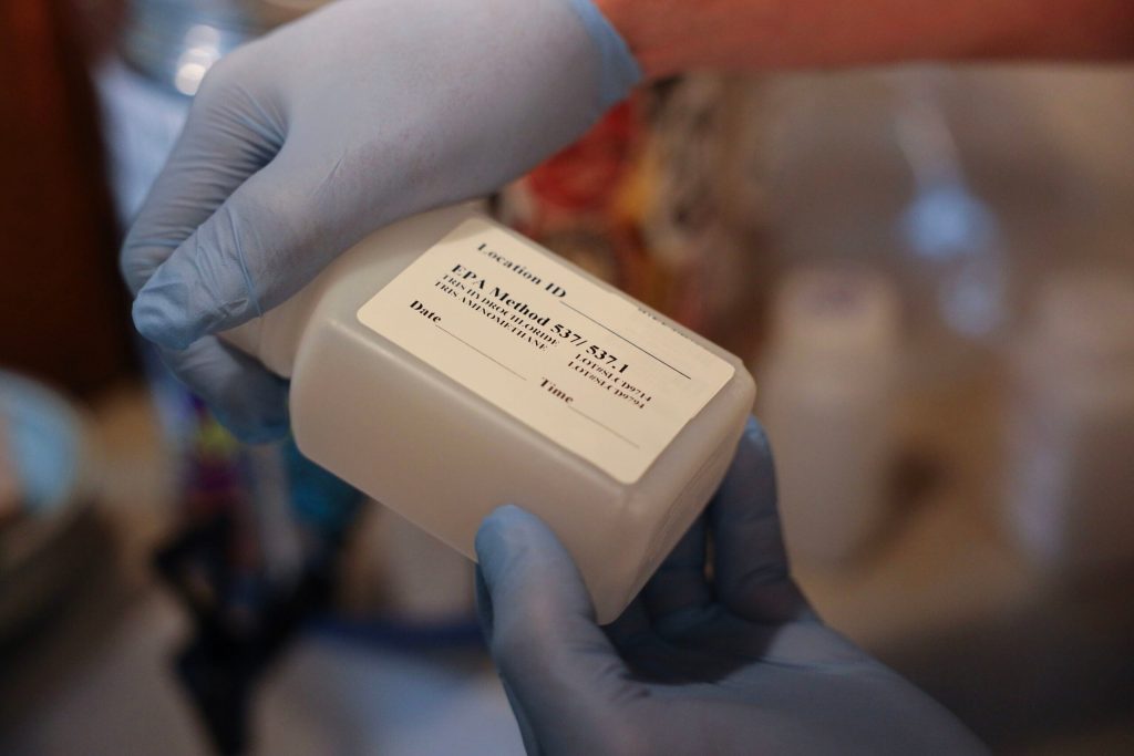 Madison resident Brad Horn collects a water sample to test for PFAS in Madison, Wis., on Aug. 8, 2022. Coburn Dukehart/Wisconsin Watch