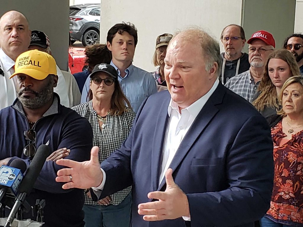 Former Supreme Court Justice Michael Gableman and other organizers of an effort to recall Assembly Speaker Robin Vos speak outside the Wisconsin Elections Commission on Tuesday, May 28, 2024. Shawn Johnson/WPR