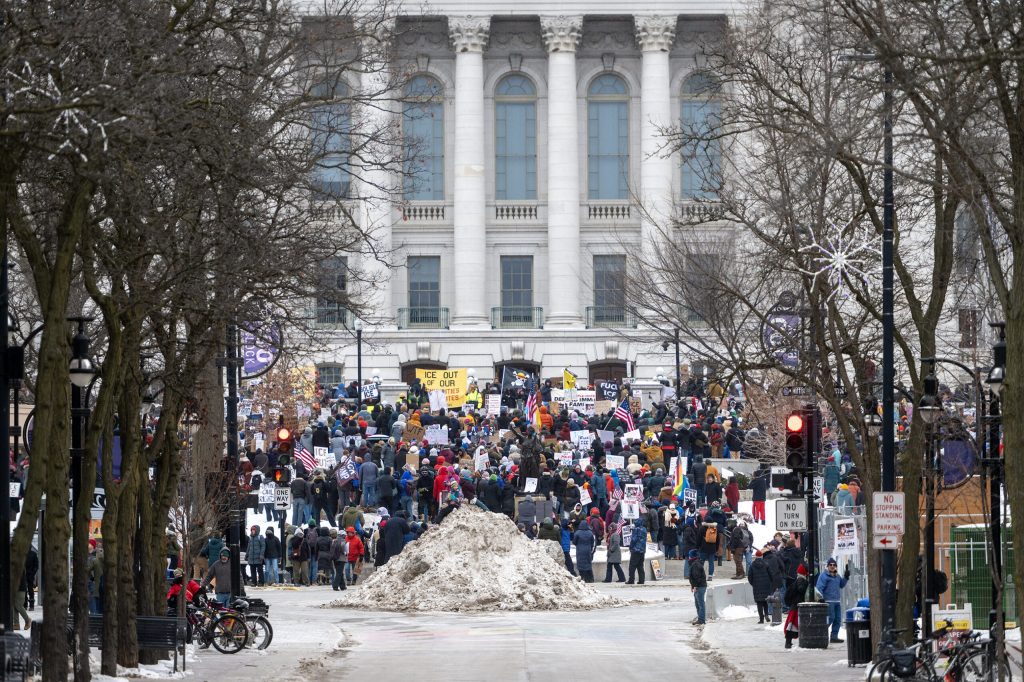 Protesters gather in cold conditions to protest ICE and the Trump administration Sunday, Jan. 25, 2026, in Madison, Wis. The protest came after a Border Patrol agent shot and killed Alex Pretti in Minneapolis the day before. Angela Major/WPR
