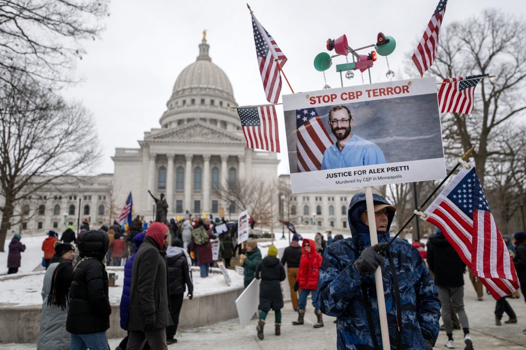 Protesters gather to protest ICE and the Trump administration Sunday, Jan. 25, 2026, in Madison, Wis. The protest came after a Border Patrol agent shot and killed Alex Pretti in Minneapolis the day before. Angela Major/WPR