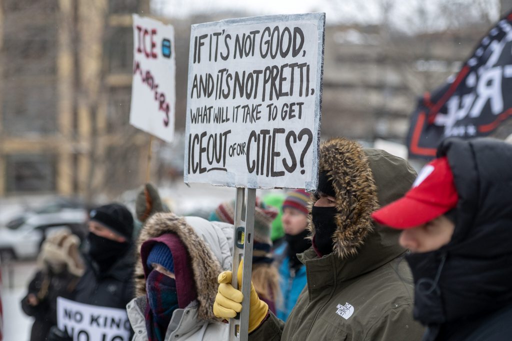 Protesters gather to protest ICE and the Trump administration Sunday, Jan. 25, 2026, in Madison, Wis. The protest came after a Border Patrol agent shot and killed Alex Pretti in Minneapolis the day before. Angela Major/WPR