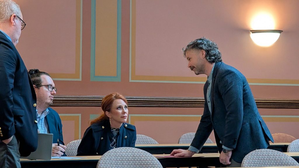 Deputy State Superintendent Tom McCarthy speaks to Rep. Amanda Nedweski (R-Pleasant Prairie) after delivering testimony on AB 678. (Photo by Baylor Spears/Wisconsin Examiner)