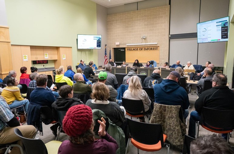 Members of the public attend a village board meeting at DeForest Village Hall in DeForest, Wis., on Jan. 20, 2026. (Kayla Wolf for Wisconsin Watch)