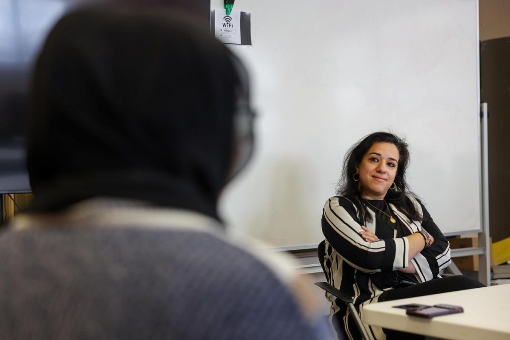 Sheila Badwan, executive director of Hanan Refugee Relief Group, listens to Maryam Durani, cultural program coordinator, Dec. 1, 2025, in Milwaukee. (Jonathan Aguilar / Milwaukee Neighborhood News Service / CatchLight Local)