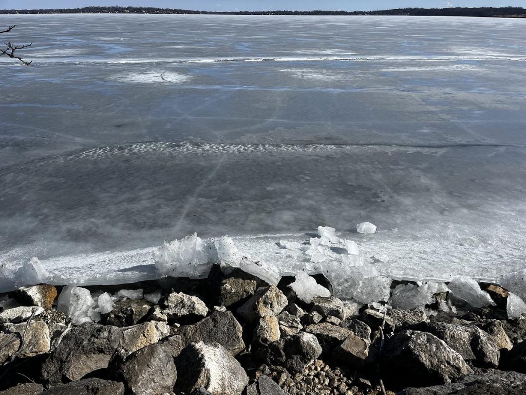 Cracks form in the ice along the shore of Lake Monona on March 8, 2025. (Jess Miller for Wisconsin Watch)