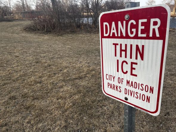 A sign warns of thin ice in Madison, Wis., on March 18, 2025. (Jess Miller for Wisconsin Watch)