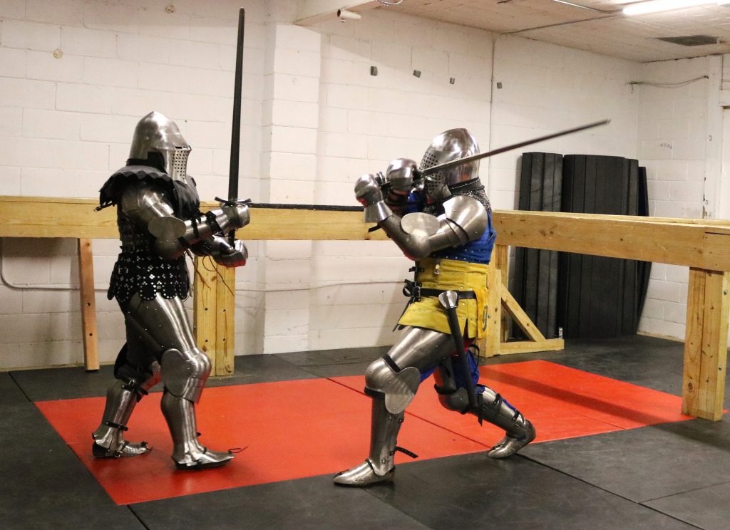 Volivia Bogust (left) and Tyler Gren spar with swords. Photo taken Feb. 9, 2026 by Sophie Bolich.