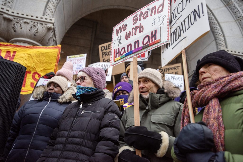 Protesters gather outside of the courthouse in support of Milwaukee County Judge Hannah Dugan on Monday, Dec. 15, 2025, at the Milwaukee Federal Building & U.S. Courthouse in Milwaukee, Wis. Angela Major/WPR