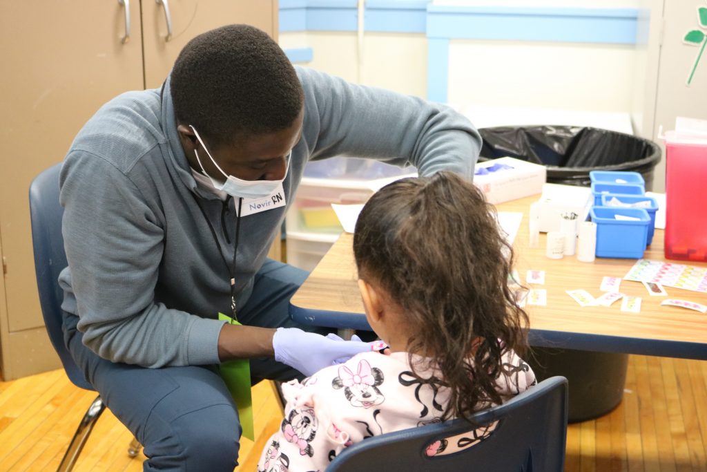 A student's blood lead levels are tested at Keefe Avenue Elementary School. Photo taken Feb. 24, 2026 by Sophie Bolich.