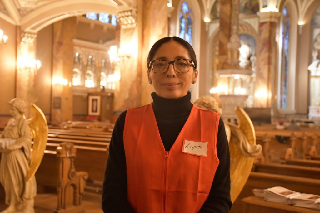 Guadalupe Diaz is visiting the life-sized statue of Our Lady of Guadalupe that is touring the globe. It made a stop in Milwaukee’s Basilica of Saint Josaphat on Friday before going to six other stops in Wisconsin. Mackenzie Krumme/WPR