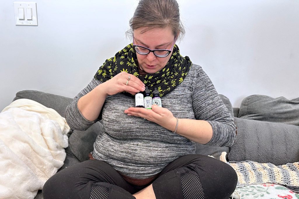 Cannabis activist Rachel Cartwright displays CBD oils she manufactures and distributes at her home in Wisconsin Dells. Anya van Wagtendonk/WPR