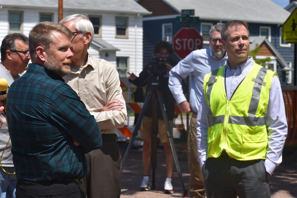 (Left to right) Superior Mayor Jim Paine, Gov. Tony Evers and Superior Water Light & Power President Rob Sandstrom on July 8, 2025. The city and utility are partnering to replace lead service lines, but they’re at odds over the city’s proposed takeover. (Danielle Kaeding/WPR)