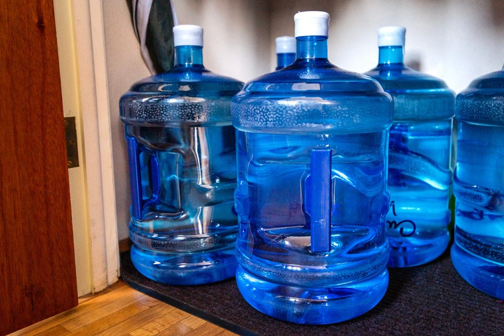 Water stored in a closet near Margie Walker and Jim Boisen’s kitchen in their French Island home Friday, Feb. 21, 2025. Angela Major/WPR
