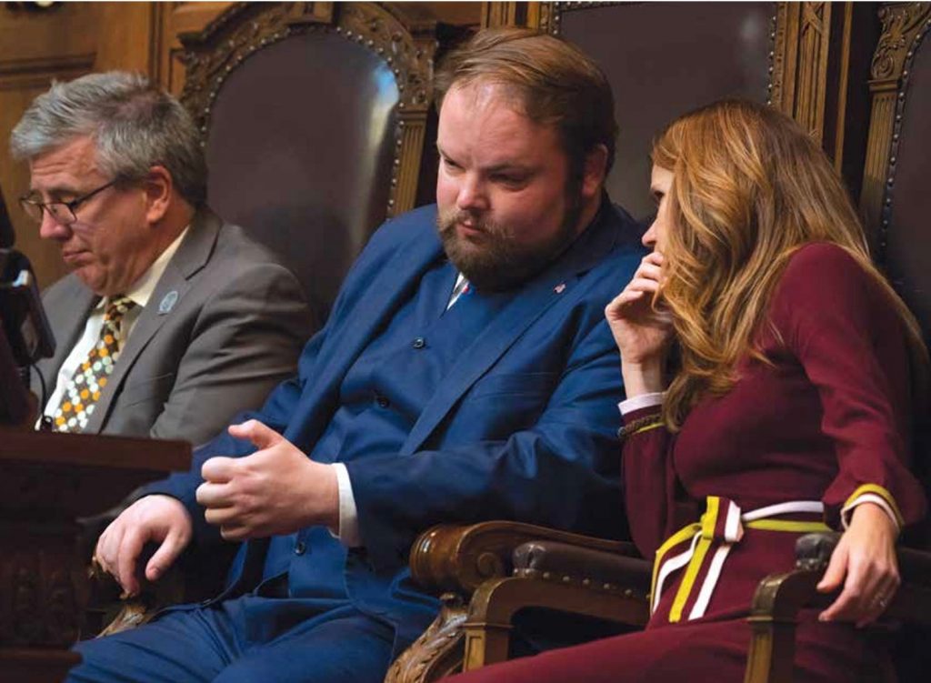 Then-Rep. Chris Taylor, right, speaks with Rep. Tyler August, R-Walworth, on the floor of the Assembly during the 2017-2018 legislative session. Image source: Wisconsin Blue Book