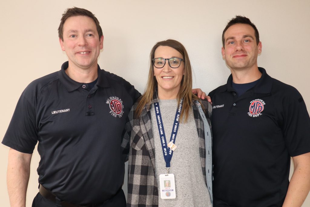 Jonathan Belott (left) stands with Amy Molinski (center) and Robert Rehberger (right). (Photo by Isiah Holmes/Wisconsin Examiner)