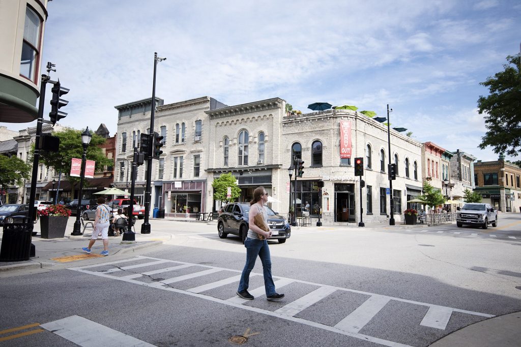 Pedestrians cross a street Friday, Jul 31, 2020, in Waukesha. Angela Major/WPR
