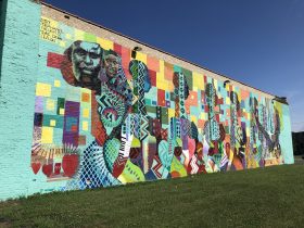 Mural by George Gist on the side of 2620 W. Center St. (Wisconsin Black Historical Society). Photo by Jeramey Jannene.