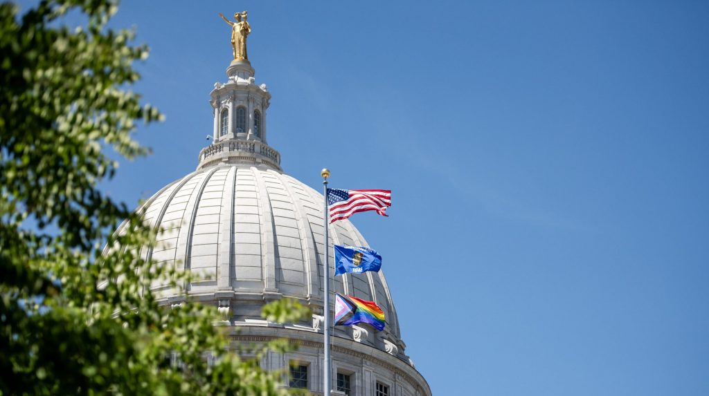 A Progress Pride flag is raised Friday, May 31, 2024, at the Wisconsin Capitol in Madison, Wis. Angela Major/WPR