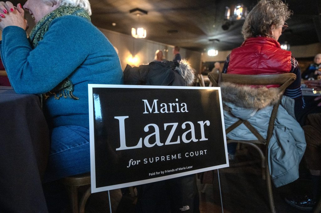A sign for Wisconsin Supreme Court Candidate Maria Lazar at one of her campaign events Tuesday, March 10, 2026, in Germantown, Wis. Angela Major/WPR