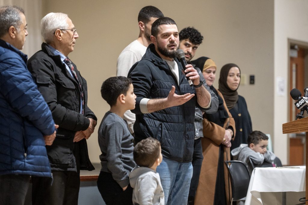Salah Sarsour’s family speaks to a crowd gathered to support him on Thursday, April 2, 2026, at the Islamic Society of Milwaukee Community Center in Milwaukee, Wis. Angela Major/WPR