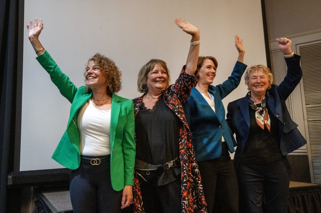 From left, Wisconsin Supreme Court Justices Rebecca Dallet, Janet Protasiewicz, Susan Crawford, and former Justice Ann Walsh Bradley, right, celebrate Judge Chris Taylor’s win Tuesday, April 7, 2026, at the Madison Concourse Hotel in Madison, Wis. Angela Major/WPR