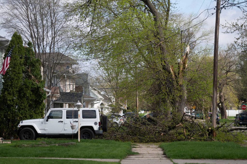 Debris from a severe storm covers a sidewalk Saturday, April 18, 2026, in Janesville, Wis. Angela Major/WPR