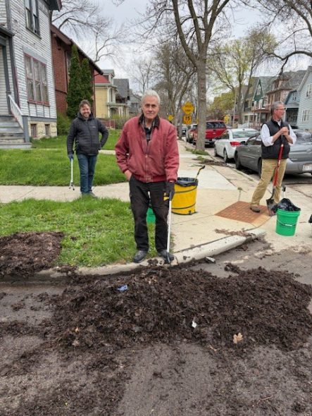 Alderman Bauman cleaning a catch basin. Photo courtesy of Bauman's office.