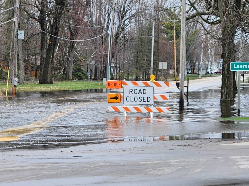 A road closed sign is seen on a flooded street in Shiocton, Wis. on April 15, 2026. Joe Schulz/WPR