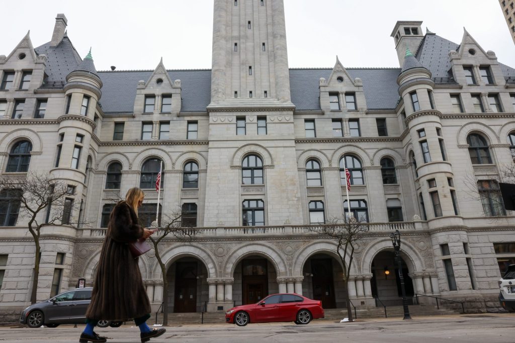 A person walks in front of the U.S. District Court for the Eastern District of Wisconsin, which hears habeas petitions filed in Wisconsin. (Jonathan Aguilar / Milwaukee Neighborhood News Service / CatchLight Local)