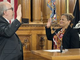 Karin Tyler (right) takes her oath of office from City Clerk Jim Owczarski on April 21. Photo by Jeramey Jannene.