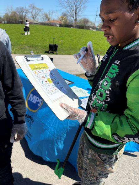 Morse Middle School student, Kartier Gordon, 11, searches for Earth Day related animals and items to win bingo. Corrinne Hess/WPR