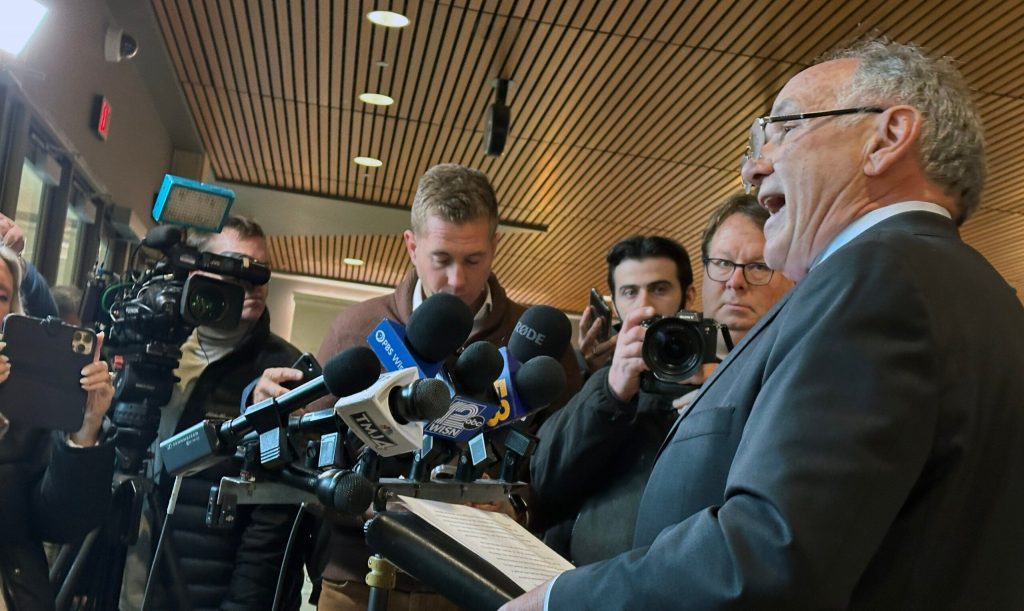 GOP attorney and former judge Jim Troupis speaks to reporters in Madison after making an initial appearance on 11 felony charges tied to his role in the 2020 false elector plot that aimed to overturn President-elect Donald Trump’s Wisconsin loss to President Joe Biden, in December 2024. Anya Van Wagtendonk/WPR