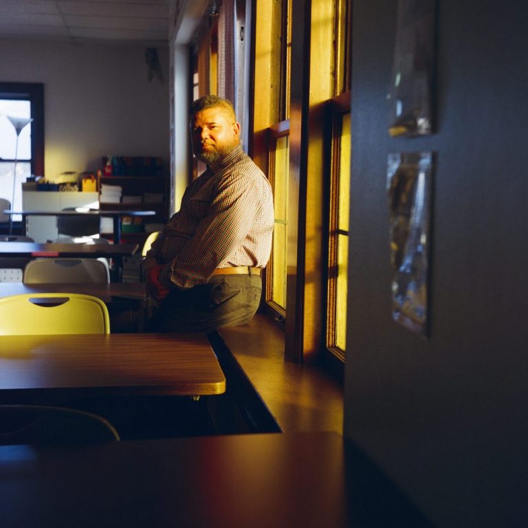 Mohamed Anwar, co-founder, president and executive director at the Burmese Rohingya Community of Wisconsin, sits for a portrait in a classroom Jan. 19, 2026, in Milwaukee. Photo by Joe Timmerman / Wisconsin Watch.