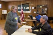 Town of Lima Municipal Clerk Pam Hookstead works on Election Day, April 7, 2026, alongside her husband, right, a longtime poll worker. (Alexander Shur / Votebeat)
