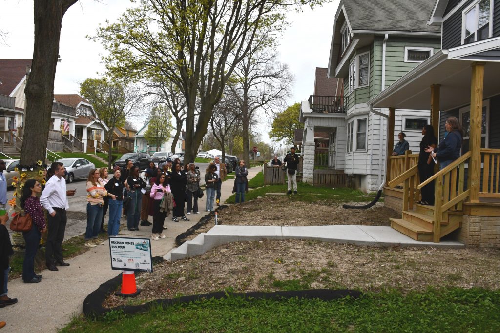 NextGen Homes tour participants in front of a Milwaukee Habitat for Humanity home at 3260 N. Palmer St. Photo by Jeramey Jannene.