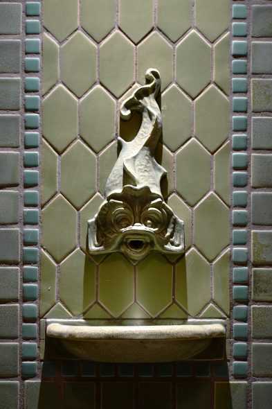 A detail image of the dolphin spout created by the Continental Faience & Tile Co. Photo by Ben Tyjeski.