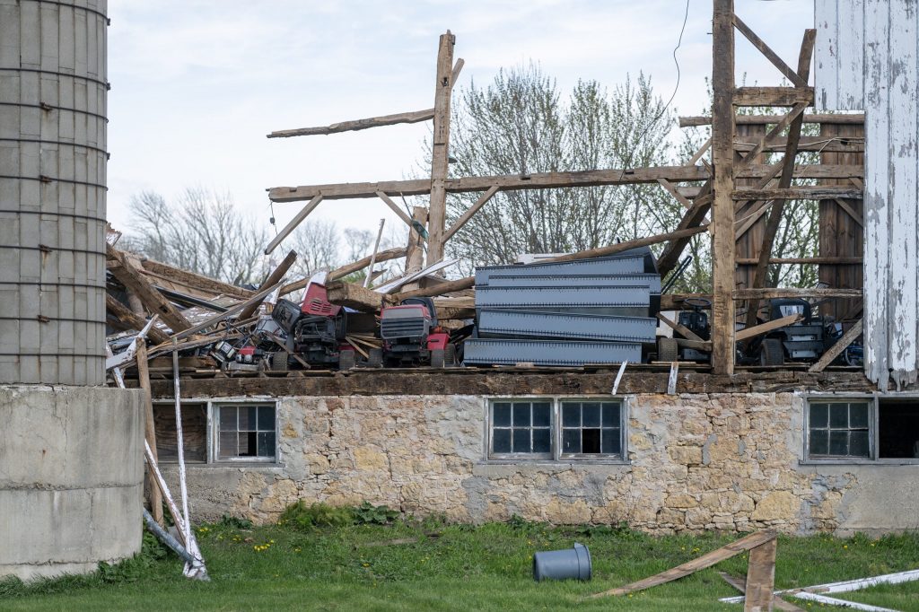 The remains of a barn damaged by a severe storm remains Thursday, April 23, 2026, in Emerald Grove, Wis. Angela Major/WPR