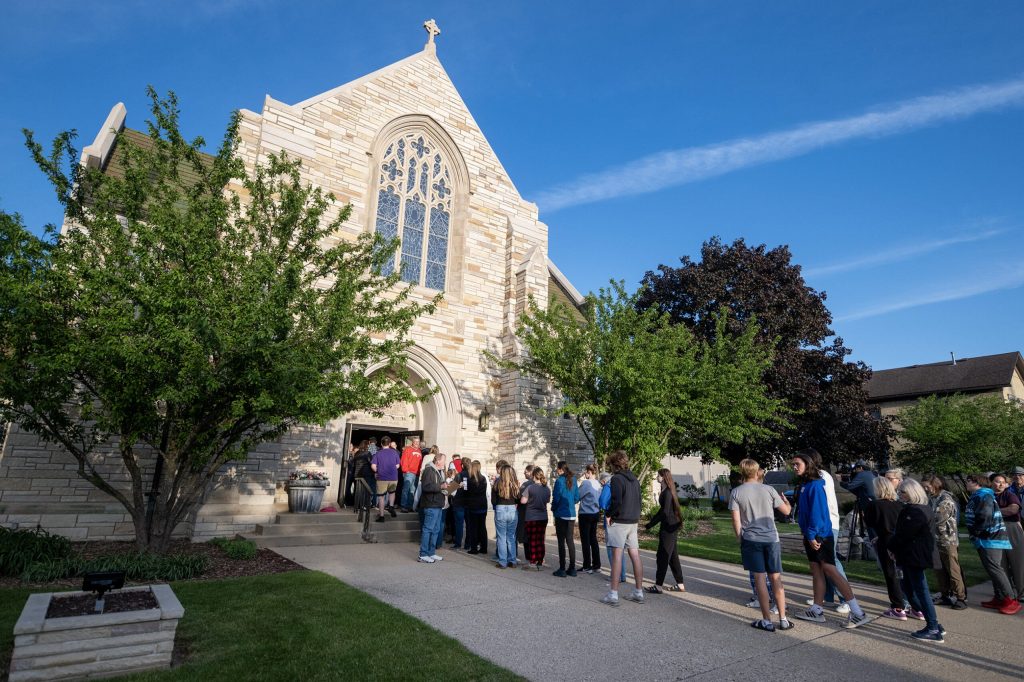 People enter the church to listen to students perform “A Mother of A Revolution!” on Wednesday, May 20, 2026, at Immanuel Evangelical Lutheran Church in Watertown, Wis. Angela Major/WPR
