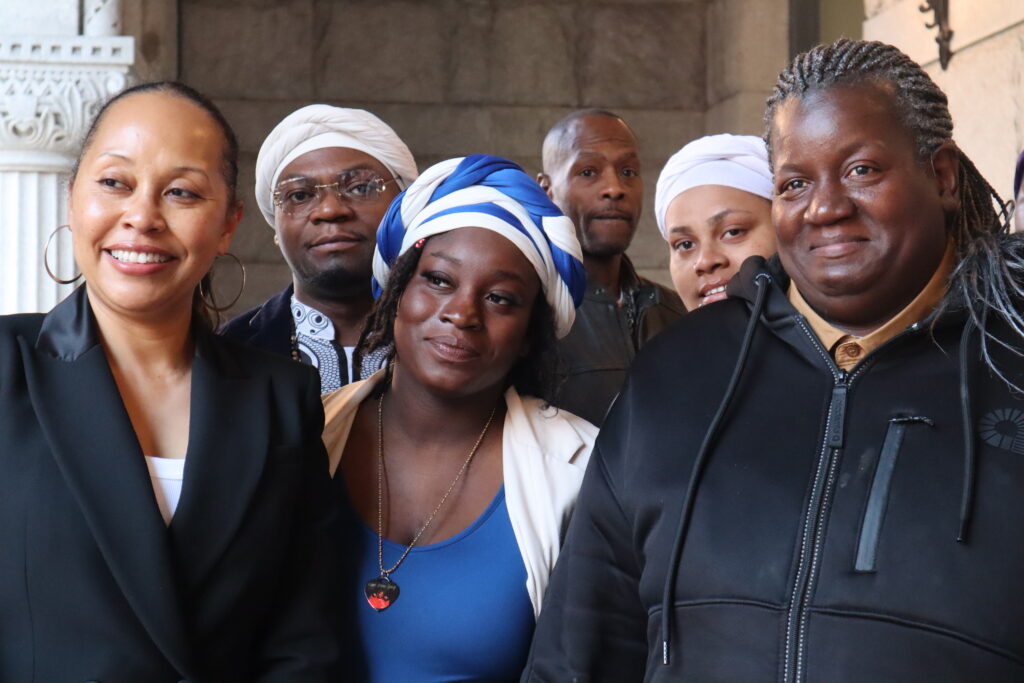Tracy Cole (right) stands with her family and attorneys outside the federal courthouse in Milwaukee in a 2025 photo. (Photo by Isiah Holmes/Wisconsin Examiner)