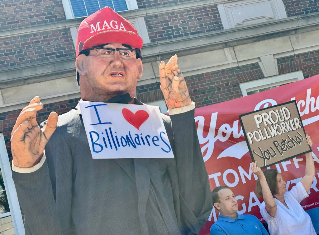 Protesters erect a puppet to protest Republican gubernatorial candidate Tom Tiffany in Madison, Wis., on May 26, 2026. Anya van Wagtendonk/WPR