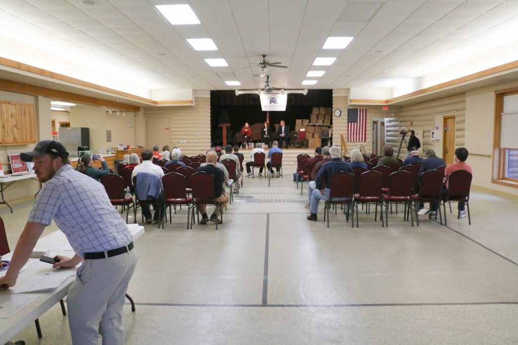 Iron County Republican Party Chaire Tanner Hiller (left) looks on during the 7th Congressional District GOP candidate debate. Hiller said staff with Michael Alfonso’s campaign told him he didn’t need to do GOP debates after getting President Donald Trump’s endorsement. Rich Kremer/WPR