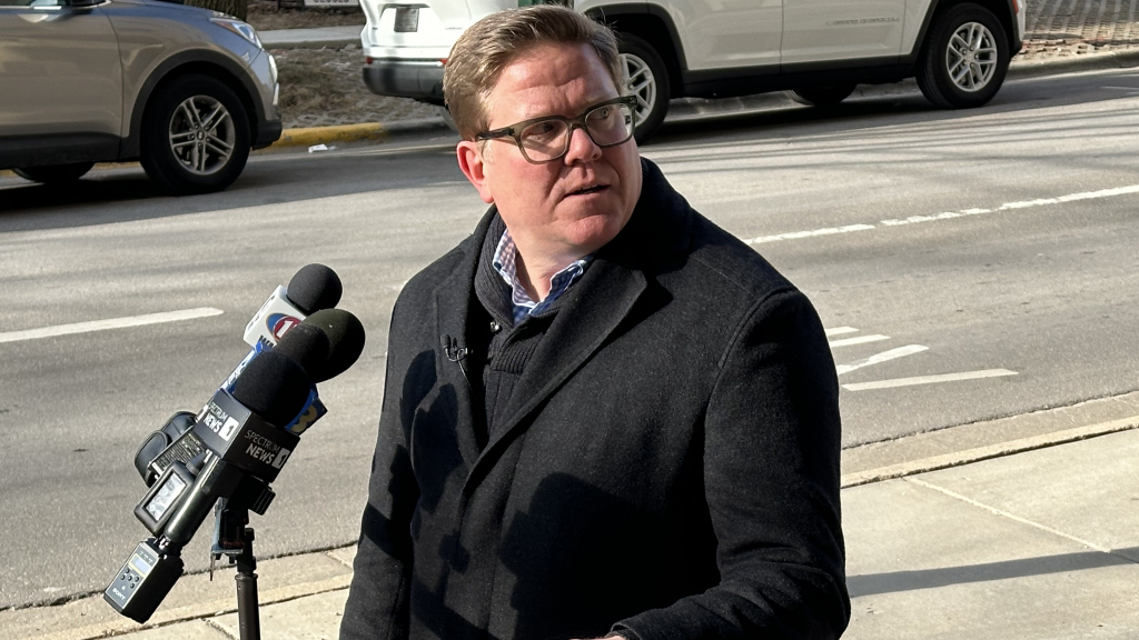 Minocqua Brewery owner and liberal activist Kirk Bangstad addresses reporters after filing a lawsuit in Dane County Circuit Court seeking to block former President Donald Trump from Wisconsin ballots, on Jan. 5, 2024 in Madison, Wis. Anya van Wagtendonk/WPR