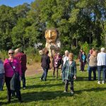 Thomas Dambo Troll Driving Tourists to Wisconsin