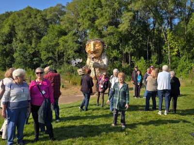Thomas Dambo Troll Driving Tourists to Wisconsin